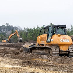 The CASE CX300D excavator and 1150M dozer work together to tackle the job.