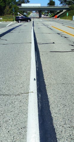 The crew applied 100 yards of the Mastic One material at a time with the drag box, saving the county countless hours.